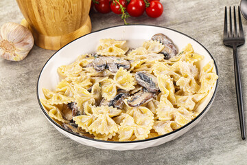 Italian cuisine - farfalle with mushrooms