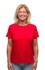 Fototapeta premium Middle age blonde woman over isolated background with a happy and cool smile on face. Lucky person.