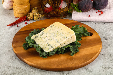 Blue cheese piece over board