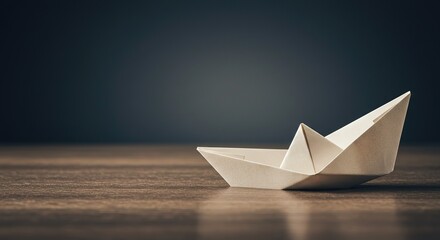 Obraz premium Handmade Origami Paper Boat on Wooden Surface - Craftsmanship and Creativity. illustrate themes of craftsmanship, creativity, traditional Japanese art, and the delicate beauty of handmade objects.