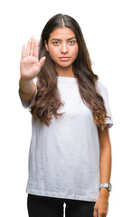 Young beautiful arab woman over isolated background doing stop sing with palm of the hand. Warning...