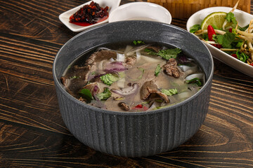 Vietnamese Pho Bo soup with beef and noodles