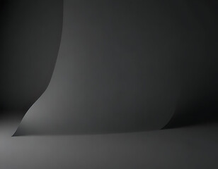 A charcoal black matte background with strong shadows.