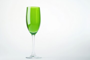 Obraz premium Isolated green matte champagne glass on white background Space for text Cocktail menu backdrop