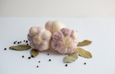 Garlic and black pepper on a white background. Spices for cooking.