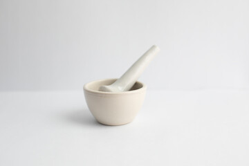 Mortar and pestle on a white background with copy space