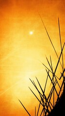 Sunset silhouette of grass vivid orange sky