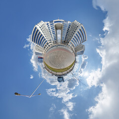 abstract swirling tiny planet spherical panorama of multi-storey buildings of skyscrapers of a...