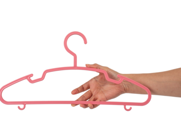 Plastic clothes hanger in hand isolated on transparent background 