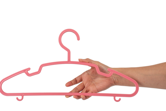 Plastic clothes hanger in hand isolated on transparent background 