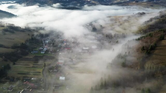 Aerial View of a Beautiful Misty Village in the Valley of the Carpathian Mountains, Slovakia