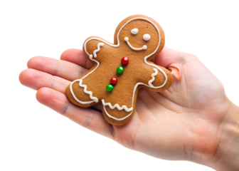 Gingerbread Man Treat: A delicious gingerbread man cookie, decorated with colorful sprinkles and icing, held in the palm of a hand.  The perfect image for holiday baking, festive treats.