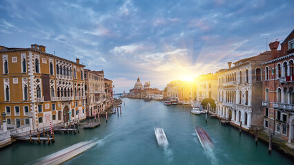 Beautiful narrow canal with silky water in Venice