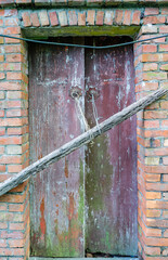 Close up shot of an old wooden door in Houtong Cat Village