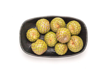 Fresh Metroxylon Sagu (Rumbia) Fruit on bowl Isolated on White Surface