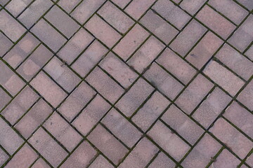 Top view of pink concrete pavement with double basketweave layout