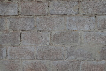 Coarse surface of whitewashed wall made of concrete masonry units