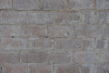 Surface of whitewashed wall made of concrete masonry units