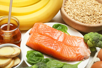 Different products rich in melatonin on white table, closeup