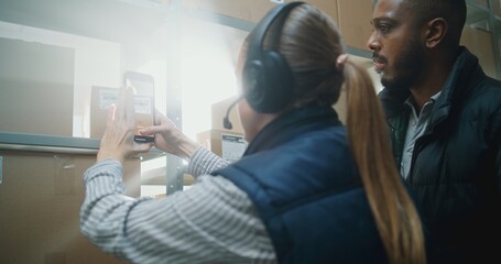 Diverse Sorting Center Employees Working in Warehouse Facility of E-Commerce Store: Female Manager...
