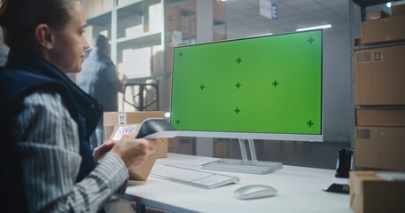 Female Warehouse Associate Scans Code on Cardboard Box with Scanner, Checks Parcel Information on...