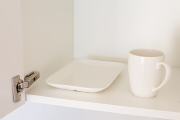 Minimalist Kitchen Cabinet with Single Cup and Plate