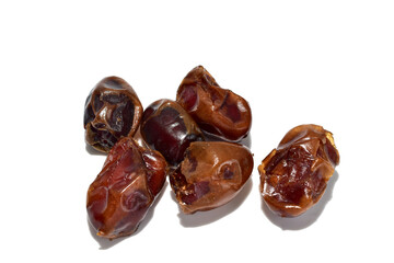 A handful of ripe dates on a white background.