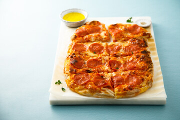 Traditional Pepperoni pizza with truffle oil