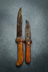 Old vintage kitchen knife. On concrete background. Top view.