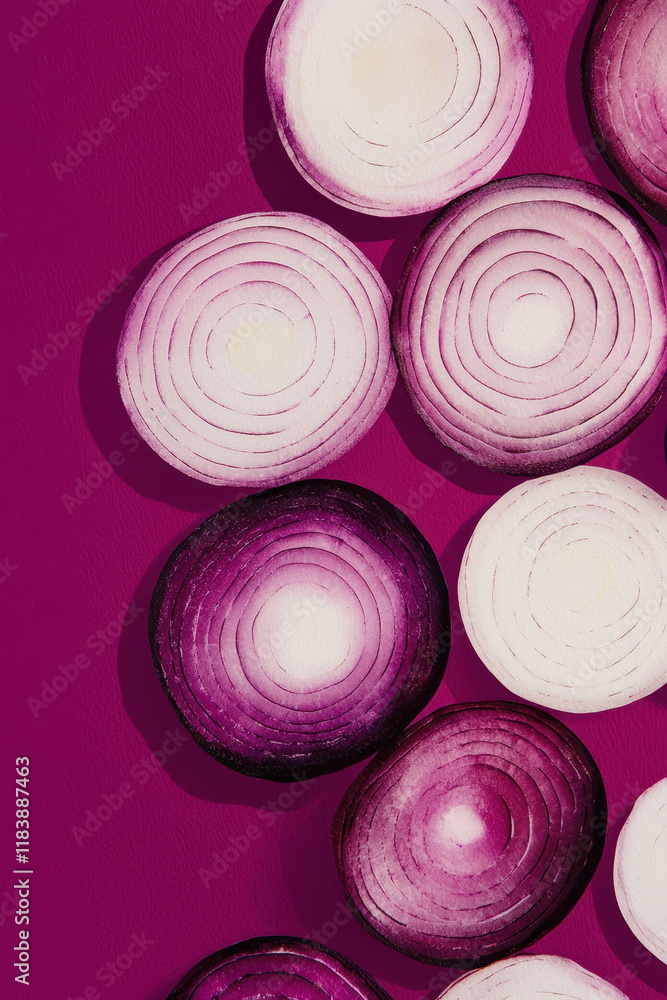 Poster sliced red onions on vibrant magenta background with intriguing circular patterns