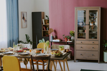 High angle shot of served festive table in cozy dining room