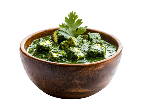 wooden bowl filled with palak paneer, traditional Indian dish made with spinach and paneer cubes, garnished with fresh cilantro, isolated on transparency background