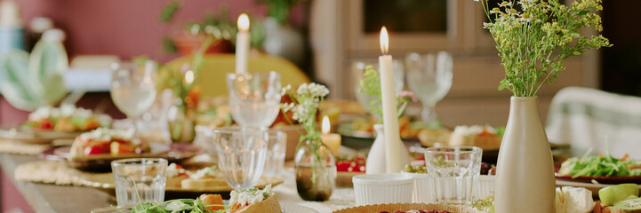 Website banner with table served with dishes and polished kitchenware