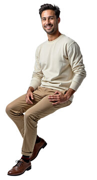 An Isolated sitting handsome young man wearing white sweater and beige chinos, isolated over transparent background, PNG cut-out	