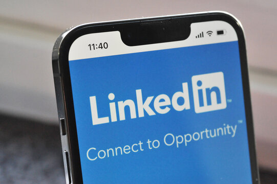 Hamburg, Germany - December 5, 2021: Apple iphone with linkedin website on the screen - Linkedin is an American business and employment-oriented online service