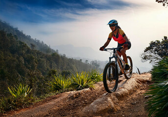 Naklejka premium Frau mit Mountainbiker unterwegs in den Alpen 