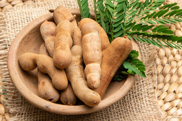 A clean and appetizing image of tamarind fruit in a bowl, perfect for food blogs, recipes, or health-focused projects.