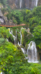 Transparent Turquoise Colored Waters of the Lake Are Having Ripples. Many Small Waterfalls Flowing Into the Lake. Plitvice Lakes, National Park, Croatian Scenery, Waterfall Views, Natural Beauty