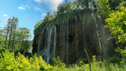 Transparent Turquoise Colored Waters of the Lake Are Having Ripples. Many Small Waterfalls Flowing Into the Lake. Plitvice Lakes, National Park, Croatian Scenery, Waterfall Views, Natural Beauty