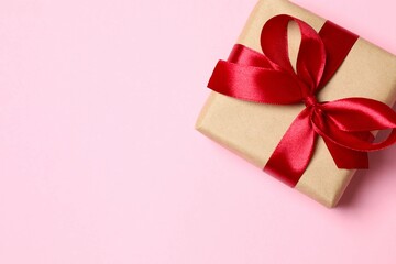 Beautiful gift box on pink background