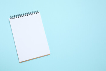 Top view photo of notebook on color background with blank space. Business concept