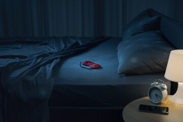 Contemporary clean bedroom interior with unmade bed