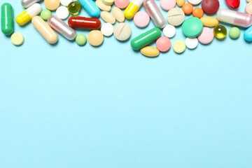 Various pills on color background