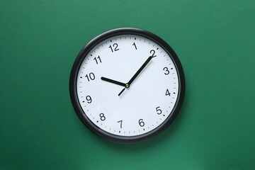 Big beautiful stylish clock on color background
