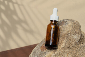 A beautiful arrangement of a skincare product displayed on a stone pedestal for mockup purposes.