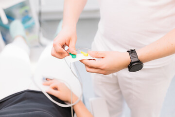 Patient with pulse and oxygen sensor at dentist's appointment. Anesthesiology