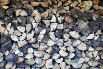 horizontal background image of old firewood carefully cut and placed to create wood texture