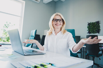 Photo of it specialist in business development blonde hair woman sitting on workplace using laptop...