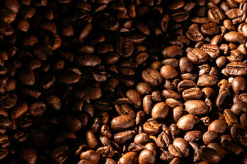 The rich texture, warm lighting, and deep brown tones evoke the aroma and comfort of freshly brewed coffee. Perfect for projects related to coffee, culinary arts, cafes, coffee culture, and gastronomy