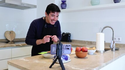 Video of a young, cheerful influencer showing the ingredients in a tutorial on how to cook a dessert at home, homemade food